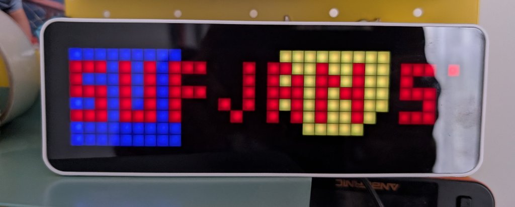 Ulanzi/Awtrix 3 display showing Home Assistant notification with artist and track name